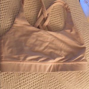 Pink and white striped Lululemon sports bra
